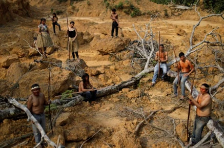 People from the Mura tribe are pictured in a deforested area in unmarked Indigenous lands inside the Amazon rainforest near Humaita, Brazil